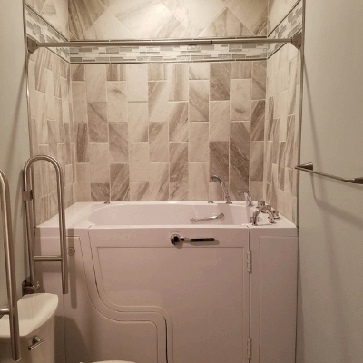 Compact walk-in tub designed for narrow spaces