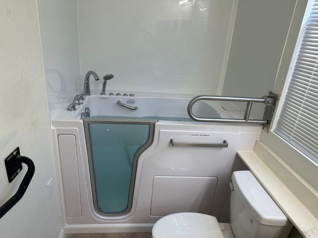 Old bathtub replacement with walk-in model