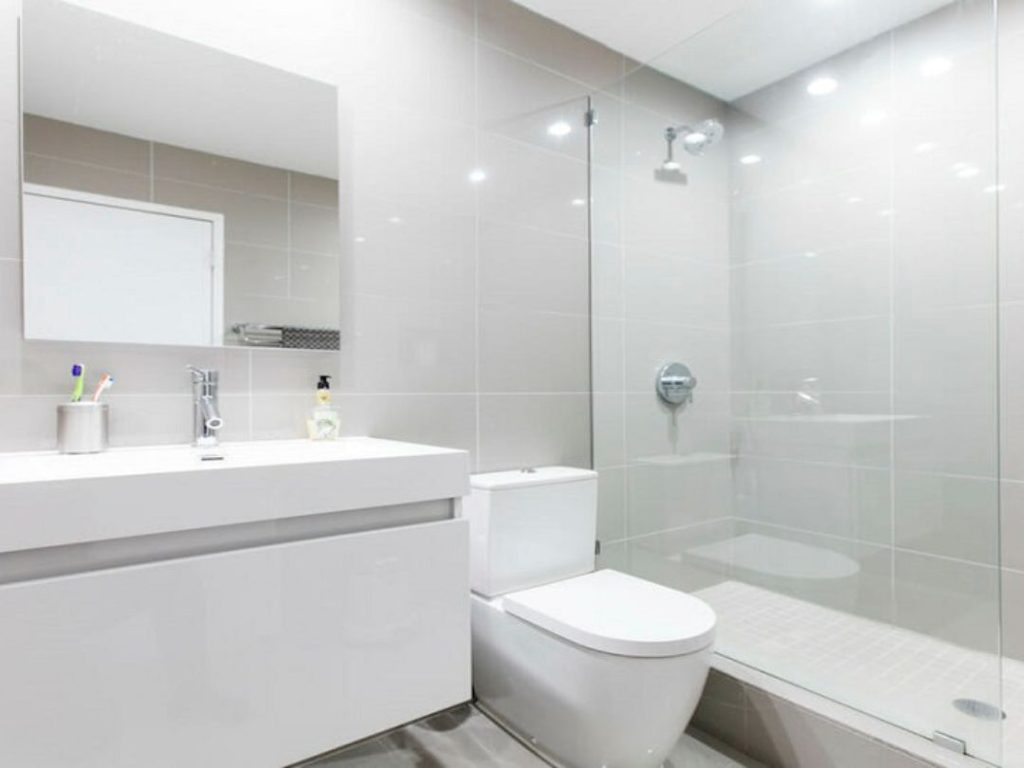 Bathtub and shower combo with glass doors