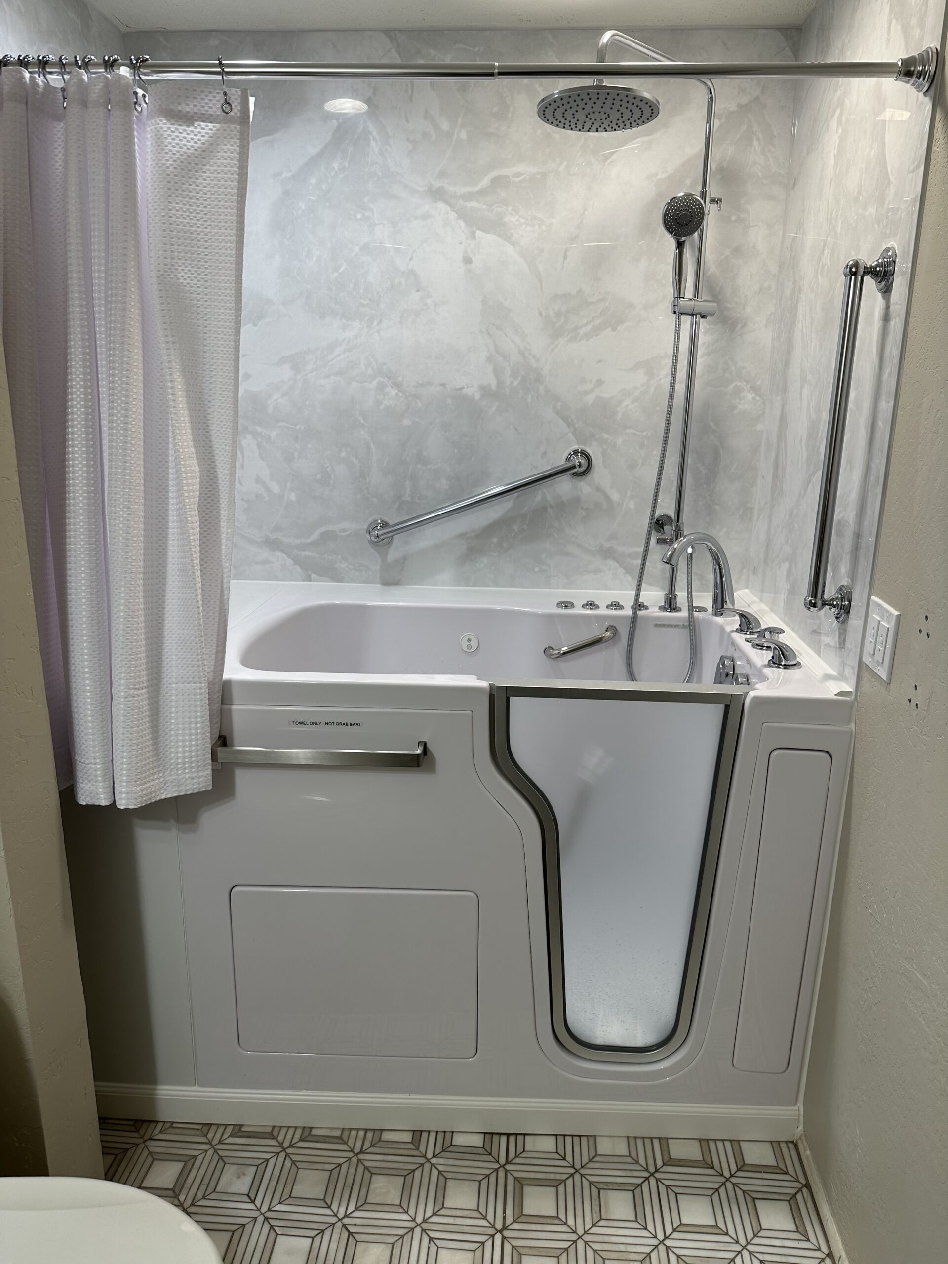 Walk-in tub with overhead shower system