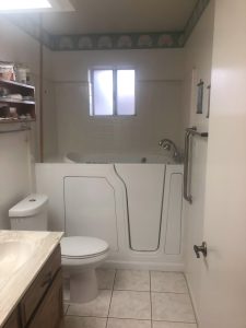 Handicap-accessible walk-in tub with shower head