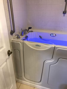 Spa-style walk-in tub with air and water jets