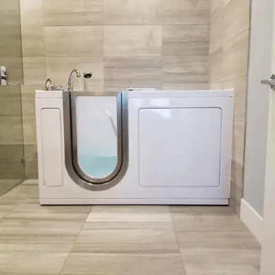 Walk-in bathtub with dual drain technology